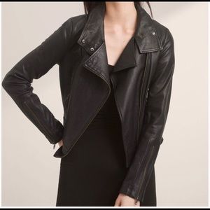 Soft leather. Needs a good clean, price reflects condition.